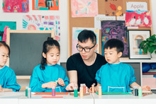 Teacher And Students In Art Class