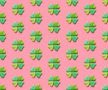 Heart-shaped Candies Re-arranged In A Clover Shape On A Pink Background