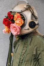 Faceless Woman In Hazmat Suit With Flowers