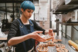 © Wells/Stocksy - pastry chef baking tarts
