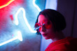 © Alexey Kuzma/Stocksy - portrait of young asian woman with neon light