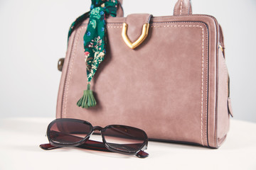 Wall Mural - woman bag with sunglasses