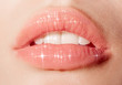 © leandro crespi/Stocksy - Close up of woman's sparkling lips