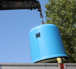 Wall Mural - garbage truck raises a blue bell jar