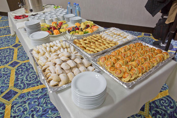 Wall Mural - Table with deserts, Sweet desserts and pastries on the table .barley, chopped fruit, glass. Luxury hotel restaurant deserts open buffet.