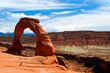 © Ralf - View on red isolated red sandstone arch with rugged stone valley background - Delicate arch, Arches national park, Utah
