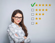 The best rating, evaluation. Business confident happy woman voting to five yellow star to increase ranking. On grey background. Closeup