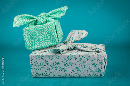 Fabric wrapped gifts, reusable sustainable recycled textile gift wrapping alternative zero waste concept