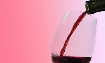 Canvas Print - Red wine pouring in glass isolated on white background