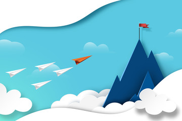 Wall Mural - paper airplane teamwork flying to red flag on the top of mountain.business leadership and success co