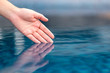 © Farknot Architect - Closeup image of a hand soaking into clear water