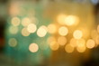 Bokeh from indoor lighting, Colorful light circles spread on blue with yellow and green background for the celebration of the holiday season