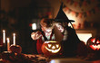 © JenkoAtaman - happy children in costumes of witch and vampire in a dark house in halloween.