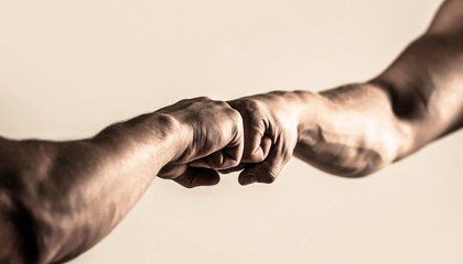 Wall Mural - People bumping their fists together, arms. Friendly handshake, friends greeting. Man giving fist bump. Hands of man people fist bump team teamwork, success. Team concept