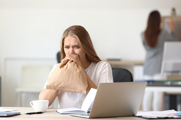 Wall Mural - Woman having panic attack at workplace