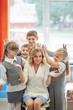 © Aleksandr - group of students having fun with their teacher