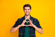 © deagreez - Photo of amazing guy making arms heart romance invitation to students prom wear casual plaid shirt isolated yellow color background