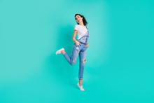 Full Length Body Size View Of Her She Nice Attractive Lovely Cheerful Cheery Girl Wearing Blue Overall Standing On One Leg Tiptoe Free Time Isolated On Bright Vivid Shine Green Turquoise Background