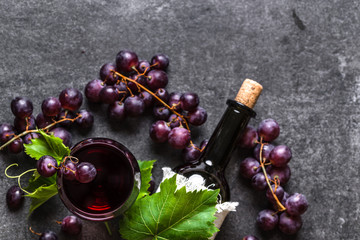 Wall Mural - Grape wine background. Red wine glass and bottle with cork.