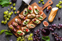 Traditional Tapas Bar, Spanish Table With Food, Platter With Appetizers Or Italian Bruschetta With Cheese And Meat. Wine Snack Set