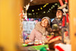 shopping, winter holidays and people concept - happy senior couple at christmas market souvenir shop on town hall square in tallinn, estonia