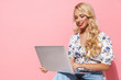 © Drobot Dean - Image of beautiful woman using silver laptop while sitting on chair