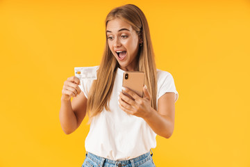 Poster - Image of happy woman smiling while holding smartphone and credit card