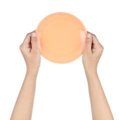 Sticker - Hand holding Empty orange plastic plate isolated on white background