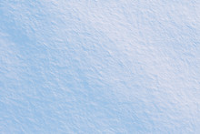 Snow Covered Field Texture. Abstract Winter Background In Blue Tones, Top View From Drone