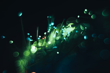 Poster - Beautiful green optical bokeh  on a glow background.