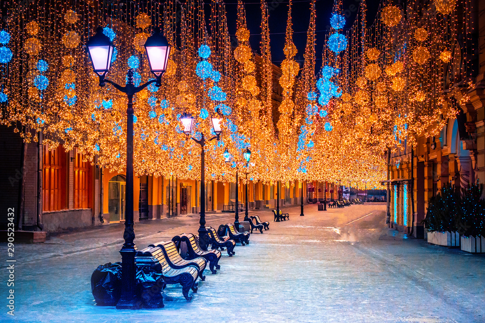 Russia. Christmas Moscow. Night lights on Moscow. Illumination in winter Moscow. Garlands in the cities of Russia. Traveling in Russian cities. Tourism in Russia in the winter. Snow. Public spaces - obrazy, fototapety, plakaty 