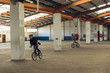 © Wavebreak Media - BMX rider in an empty warehouse