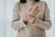 © interstid - woman holding her wrist pain