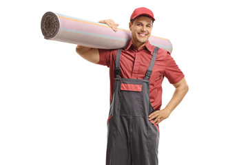 Wall Mural - Male worker holding a carpet