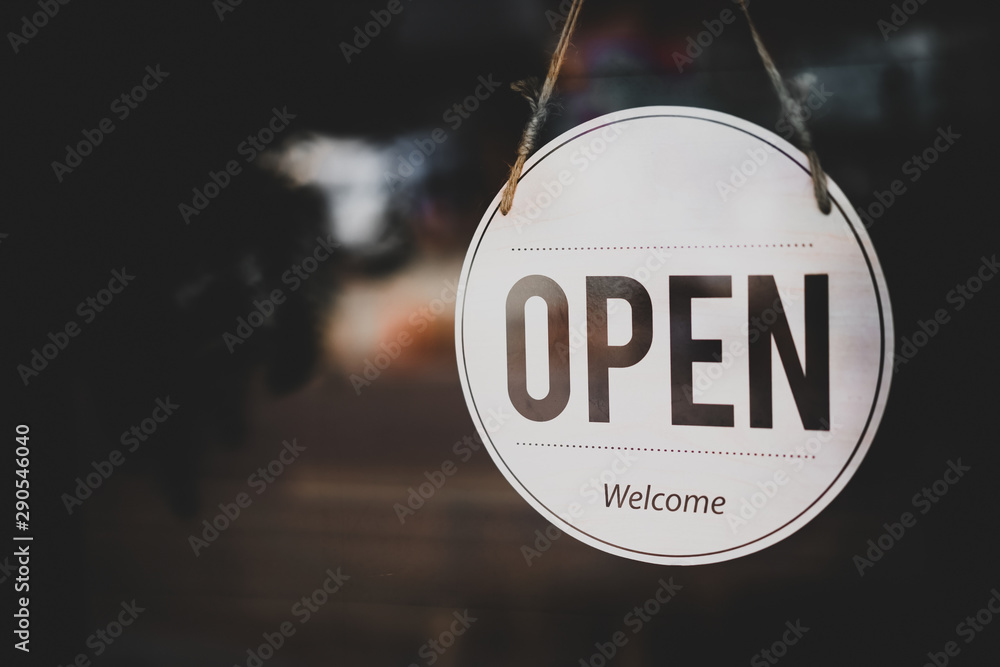 Open sign hanging front of cafe with colorful bokeh light abstract background. - obrazy, fototapety, plakaty 