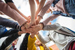 © Louis-Paul Photo - A Group of school child standing together with hand over