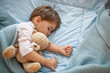 © Dragana Gordic - Cute little kid sleeping. Little boy sleeping in bed Cute little boy sleeping, tired child taking a nap in his small bed, clean, fresh and cozy bedding sheets, bedtime for kids