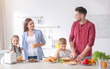 © Africa Studio - Happy family having breakfast with toasts in kitchen