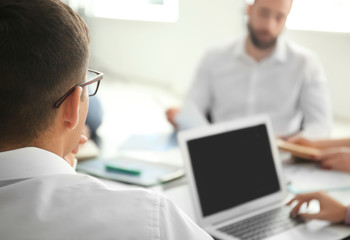 Poster - Young marketing expert with team at business meeting