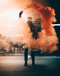 © Josh Joshua/Scopio - Man holding smoke flare in garage