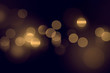 Abstract gold bokeh on black background