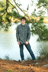 Wall Mural - Teenage Boy with Glasses Outside on a spring day smiling