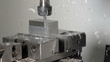 © helivideo - CLOSE UP: Drill cutting and shaving a piece of metal into an unfinished product.