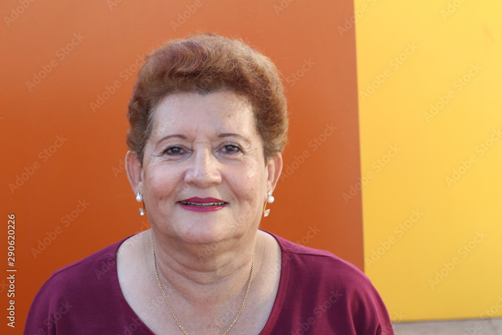 One Hispanic senior woman smiling  - obrazy, fototapety, plakaty 