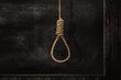 Rope noose on background, a loop of rope for hanging on a Blackboard
