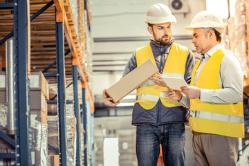 Wall Mural - Competent worker giving explanation to his direction