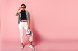 © ClaudiK - Fashion Model girl full length portrait isolated on pink background. Beauty stylish brunette woman posing in fashionable clothes in studio. Casual style, beauty accessories. High fashion urban style