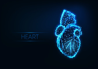 Wall Mural - futuristic glowing low polygonal human heart isolated on dark blue background.