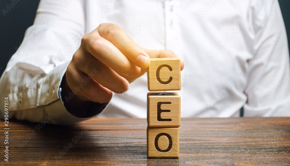 Wooden blocks with the word CEO and businessman. Chief Executive Officer. Boss, top management position in a team or company. Leader, Leadership. Business concept - obrazy, fototapety, plakaty 
