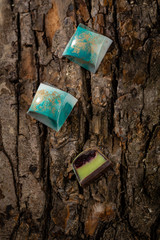 Wall Mural - Collection bonbons on wooden bark top view, food above